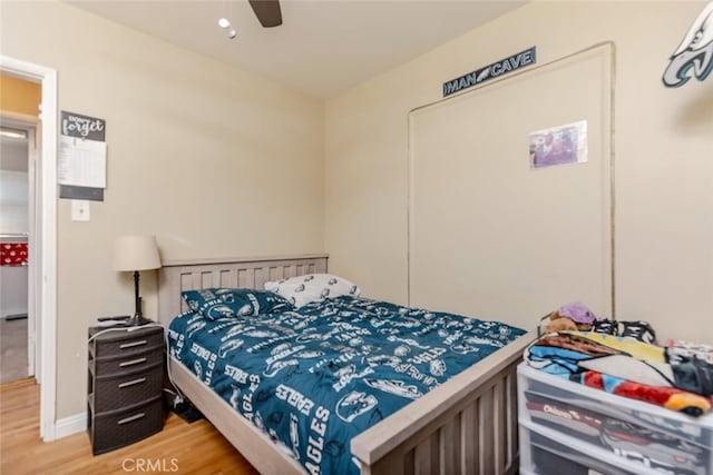 bedroom featuring ceiling fan and hardwood / wood-style flooring