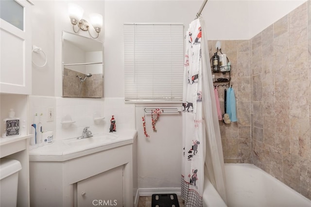 bathroom with vanity, tasteful backsplash, and shower / tub combo with curtain