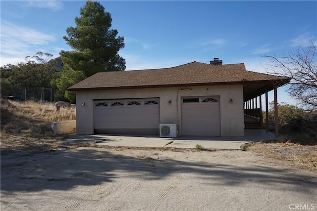 garage featuring ac unit