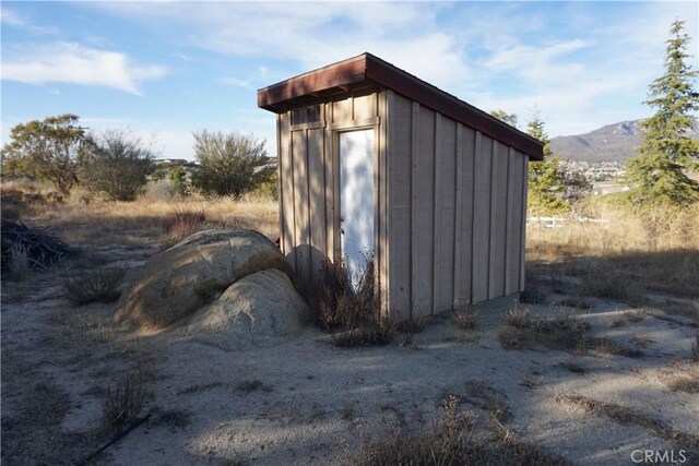 view of outdoor structure featuring a mountain view