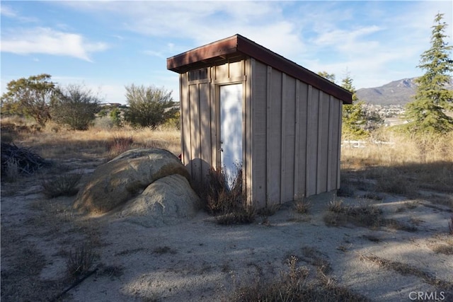 view of shed with a mountain view