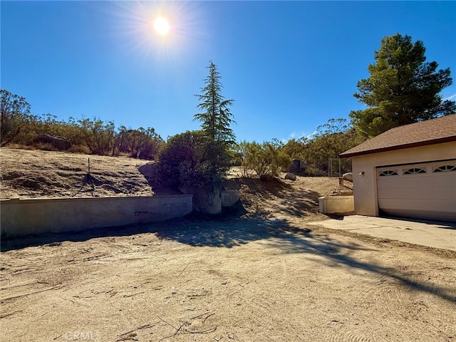 view of yard featuring a garage