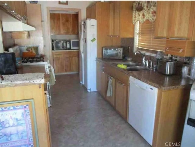 kitchen featuring white appliances and sink