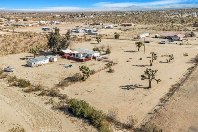 aerial view featuring a mountain view and a desert view