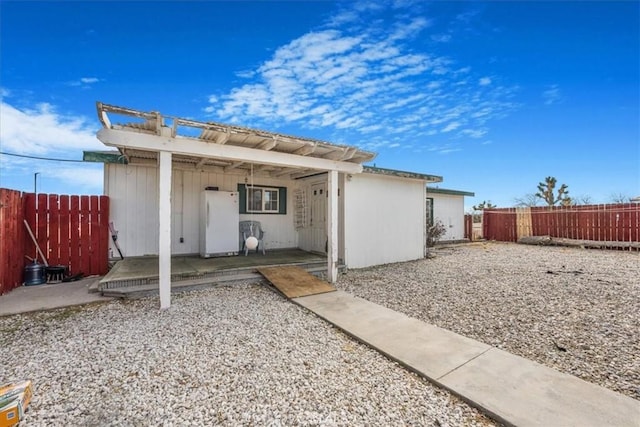 exterior space featuring a fenced backyard and a patio