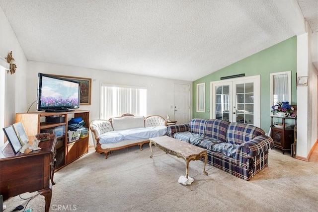 living area featuring french doors, light colored carpet, vaulted ceiling, a textured ceiling, and baseboards