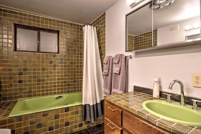 bathroom featuring vanity and shower / tub combo with curtain