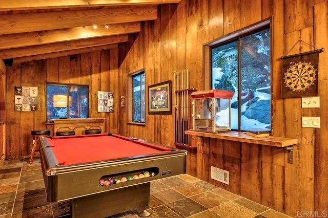 game room featuring beam ceiling, wooden walls, dark tile patterned floors, and pool table