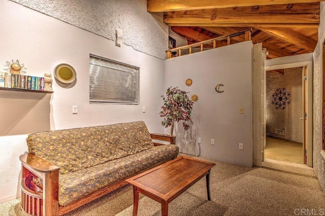 carpeted living room with vaulted ceiling with beams