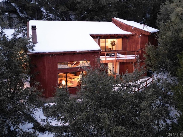 view of home's exterior with a balcony