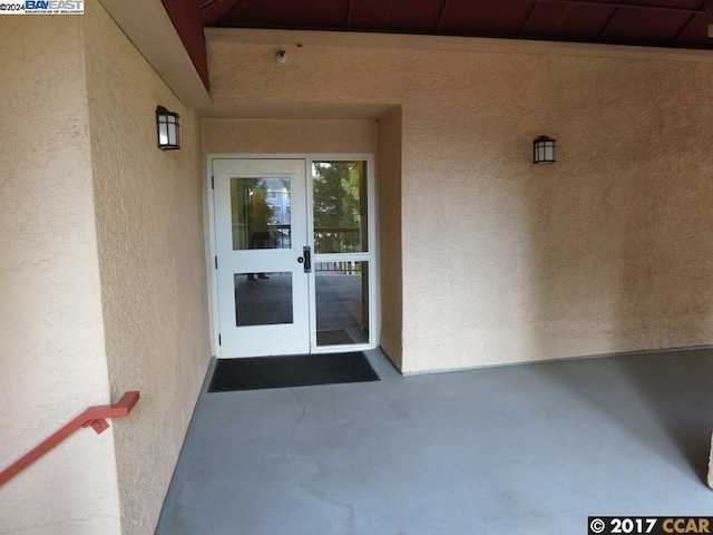 entrance to property featuring french doors