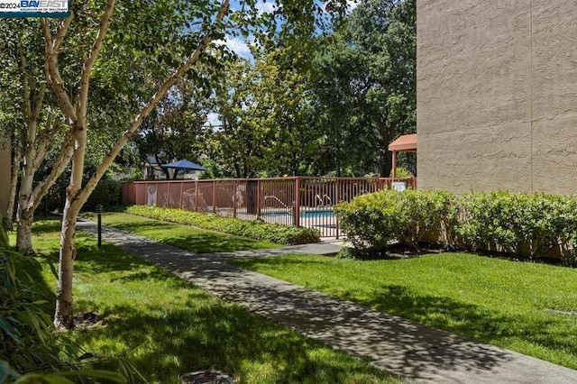 view of yard featuring a fenced in pool