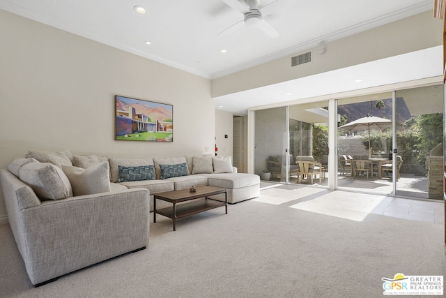 carpeted living room featuring ceiling fan and ornamental molding