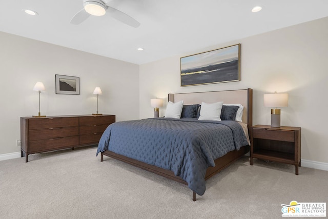 bedroom with ceiling fan and light colored carpet