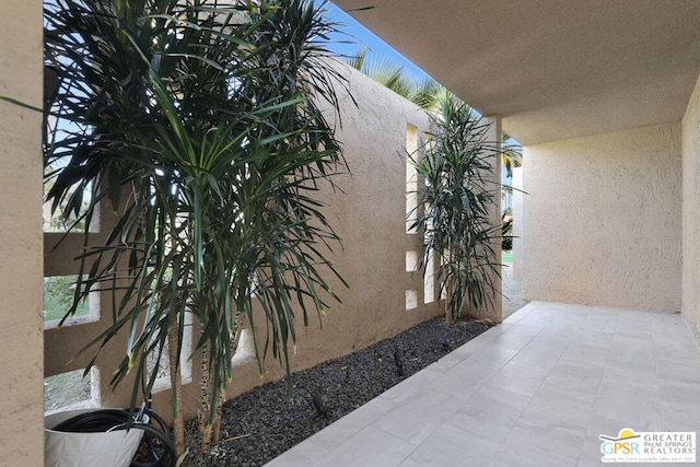 view of side of property featuring a patio area