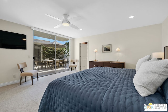 bedroom with ceiling fan, access to exterior, a wall of windows, and carpet flooring