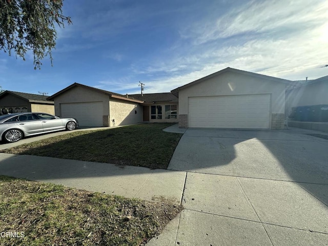 ranch-style home with a garage and a front yard