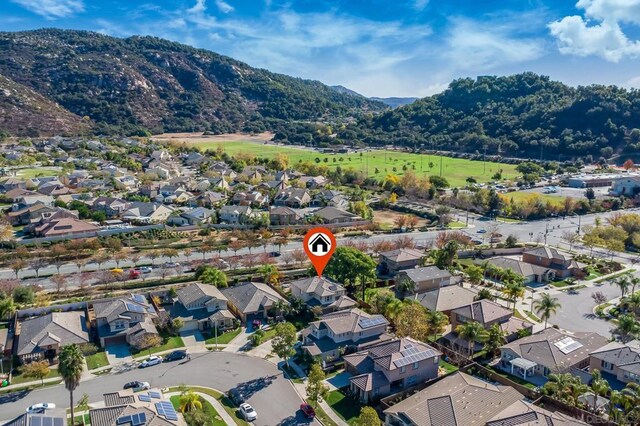 drone / aerial view featuring a mountain view