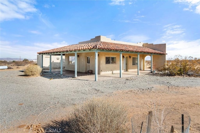 back of property featuring a patio