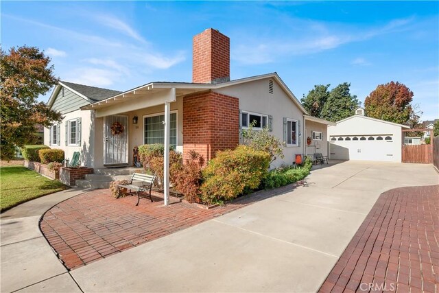 exterior space featuring an outbuilding and a garage