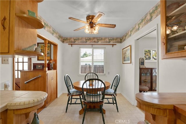 dining space featuring ceiling fan