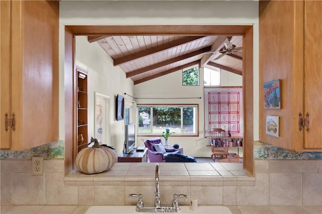 living room featuring ceiling fan, tile patterned floors, lofted ceiling with beams, and wood ceiling