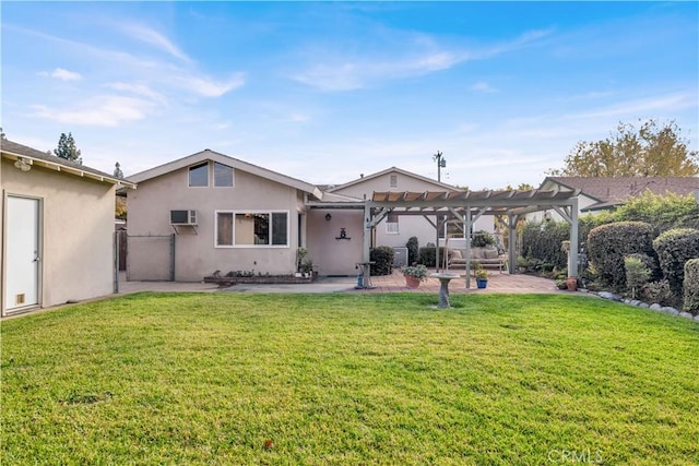 rear view of property with a wall unit AC, a pergola, a lawn, and a patio