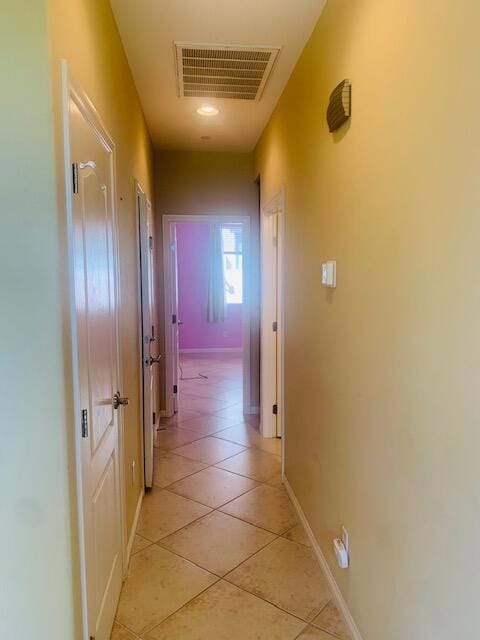 hallway with light tile patterned floors