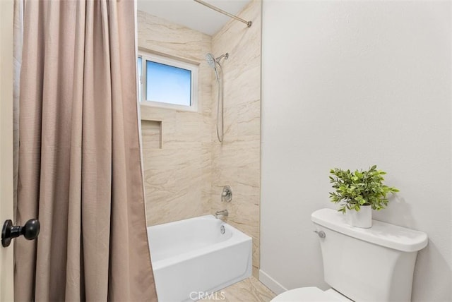 bathroom with toilet and shower / bath combo with shower curtain