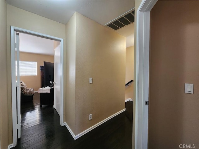 hallway with dark hardwood / wood-style floors