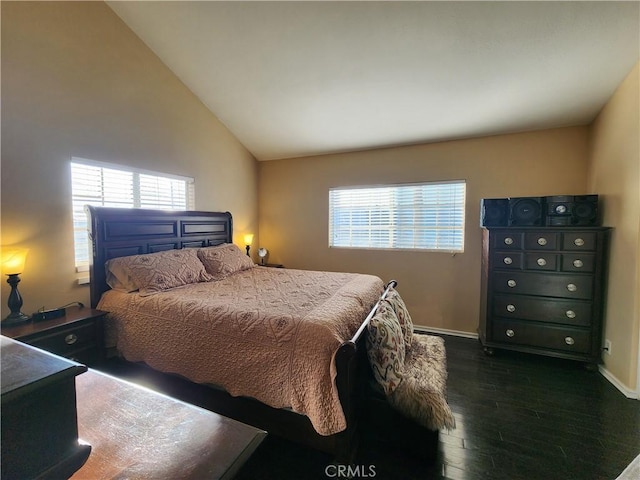 bedroom featuring lofted ceiling and dark hardwood / wood-style floors