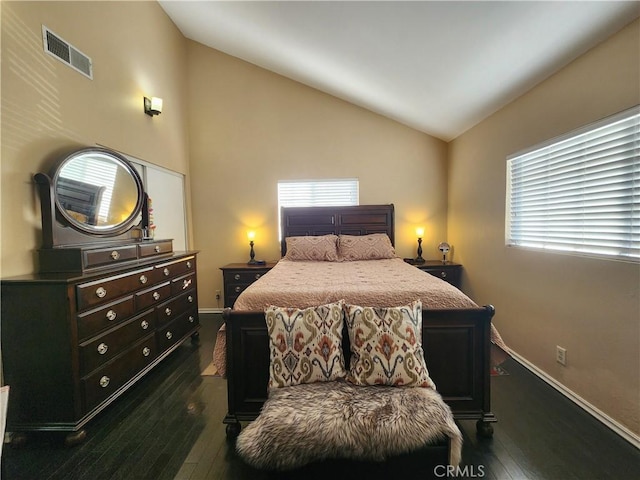 bedroom with dark hardwood / wood-style flooring and vaulted ceiling