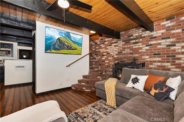 living room with beam ceiling, dark hardwood / wood-style flooring, and wood ceiling