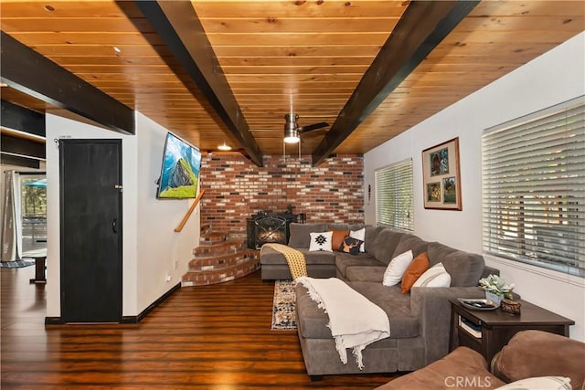 unfurnished living room featuring dark hardwood / wood-style floors, beam ceiling, wood ceiling, and a wood stove