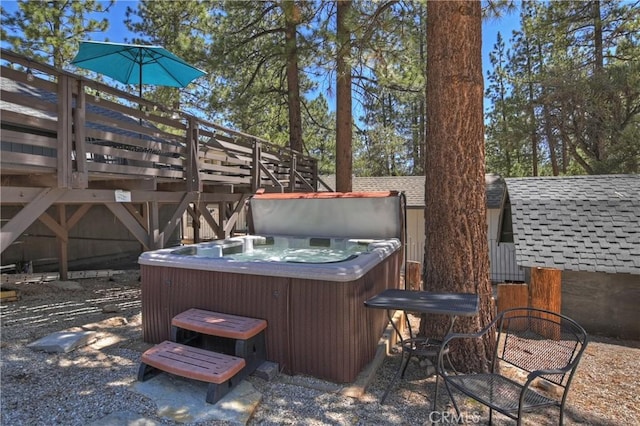 view of patio featuring a deck and a hot tub