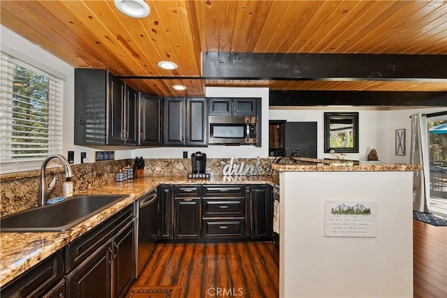 kitchen with sink, light stone counters, dark hardwood / wood-style flooring, wood ceiling, and appliances with stainless steel finishes