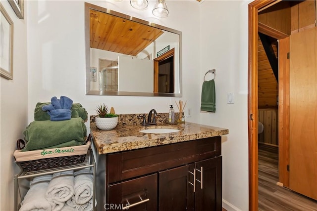 bathroom with wood-type flooring and vanity