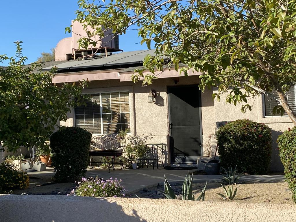 view of side of home featuring solar panels