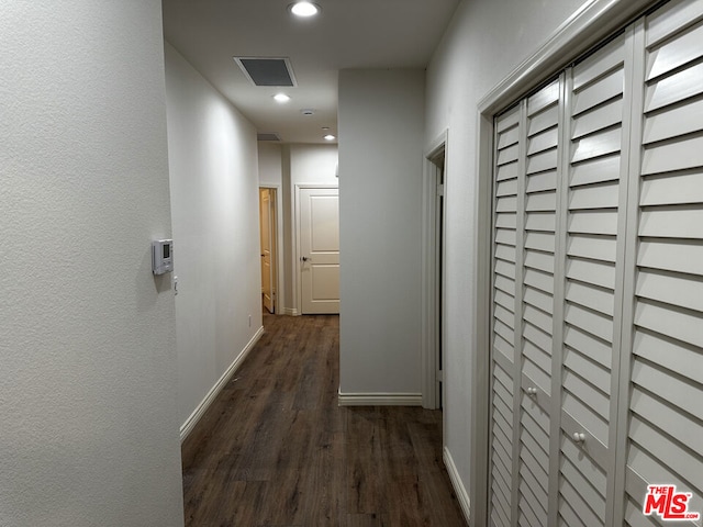 corridor featuring dark hardwood / wood-style floors