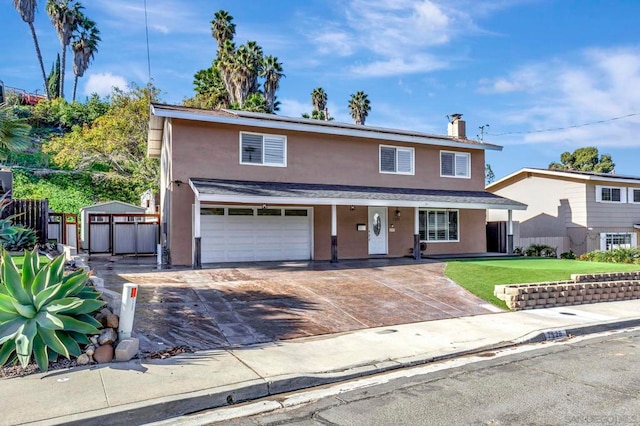 view of front property with a garage and a front lawn