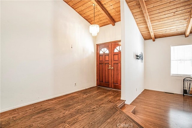 entrance foyer featuring vaulted ceiling with beams, wooden ceiling, and dark wood-type flooring