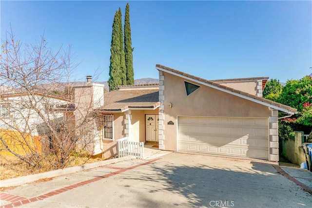 view of front of property with a garage