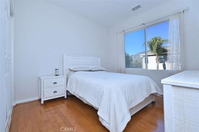 bedroom featuring dark hardwood / wood-style floors