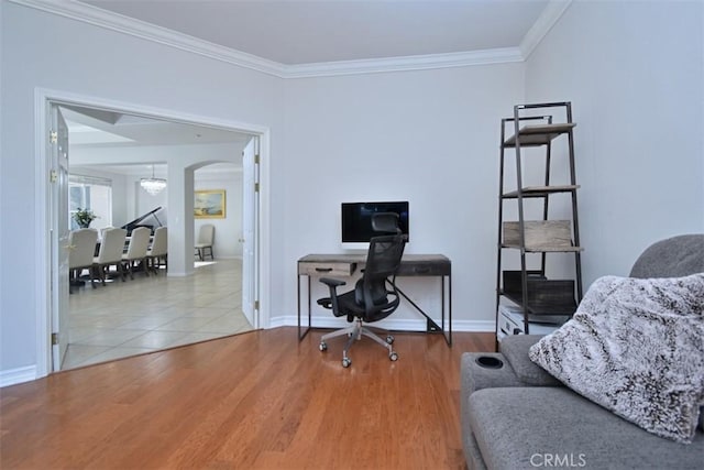 office area with crown molding, a notable chandelier, and hardwood / wood-style flooring