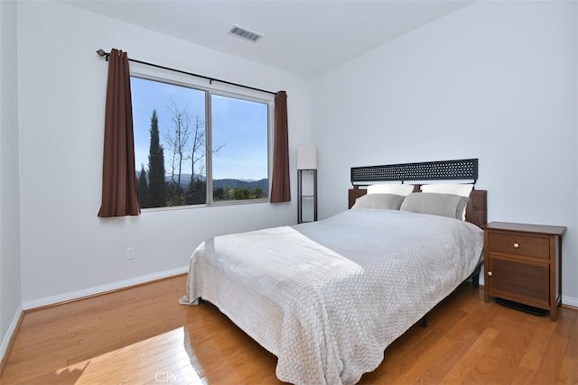 bedroom with wood-type flooring