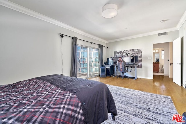 bedroom featuring wood-type flooring, ornamental molding, and access to outside