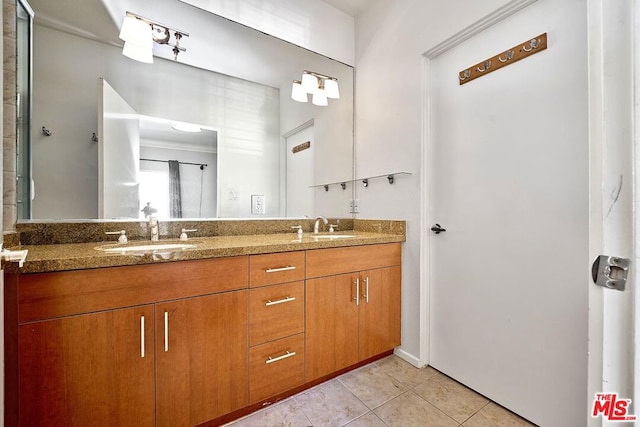 bathroom with tile patterned flooring and vanity