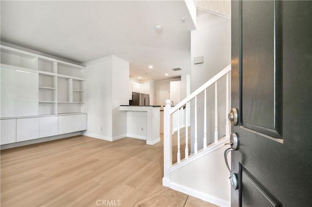 entrance foyer featuring light hardwood / wood-style floors