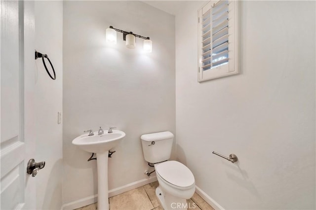 bathroom with tile patterned floors and toilet