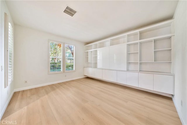 unfurnished room with light hardwood / wood-style flooring